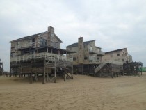Abandoned houses next to the shoreline Outer Banks NC 