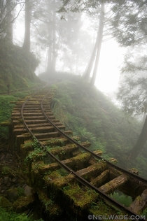 Abandoned mining railway in a clouded forest of Taiwan 