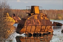 Abandoned peat harvesters somewhere in Russian swamps 