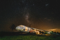 Abandoned plane under the beautiful night sky