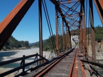 Abandoned railroad bridge over the Eel River near Humboldt Redwoods State Park CA 