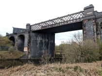 Abandoned Railway Viaduct with  shipping containers on