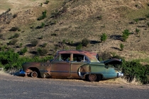 Abandoned s car on Wawawai Grade Road near the Snake River in Eastern Washington 