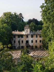 Abandoned th-century Italian estate enclosed by green wilderness  