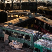 Abandoned vehicles left to decay inside a disused former bus depot in Kyiv Ukraine 
