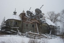 Abandoned wooden church in ruins in Vologodskaya Oblast Russia 