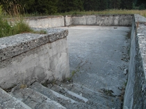 Abandoned Yugoslav swimming pool in the town of Glamo Bosnia 