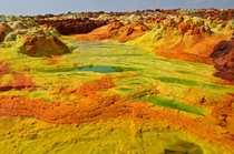 Acid lakes of the Dallol volcano The green portions are highly acidic with a pH value of less than  Photo by Colin-blog in comments 