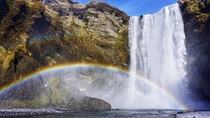 After days of grey skies we finally experienced some sunshine Couldnt have happened on a better day so we could witness a rainbow across Skogafoss Iceland 