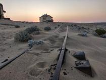 All that remains of tracks at Kolmanskop An abandoned German diamond mining town in Namibia They had a train station and also a train that moved people from one side of the town to the other