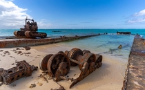 An abandoned barge and excavator on the Island of Middle Caicos Turks and Caicos