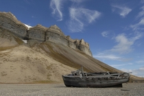 An abandoned boat beached near the Global Seed Vault in Longyearbyen Svalbard Norway Ho New 