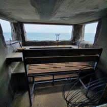 An abandoned bunker and lookout hidden inside of a rock formation in South Korea from the Korean war Yes that is barbed wire just hanging out