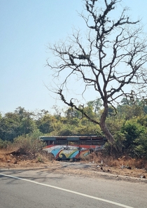 An abandoned bus on the old Mumbai-Pune highway near Lonavla Maharastra India 