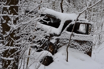 An  abandoned car in the snow in Waterloo Ontario