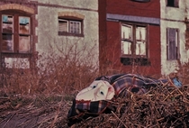 An abandoned doll by an abandoned house in an abandoned section of Philadelphia