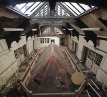 An abandoned school Originally with an open balcony that that decided to fill with this unusual glass ceiling