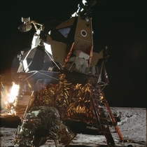 An Apollo  crew member leaving the Lunar Lander 