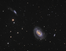 An Interacting pair of galaxies NGC and  with a spectator galaxy NGC 