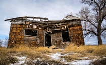 An old farmhouse collapsing in on it self outside Meriden Wyoming 