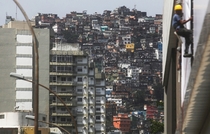 Apartment buildings stand next to houses in the Rocinha favela community Rio de Janeiro Mario Tama 