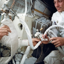 Apollo  astronaut Swigert with the rig improvised to scrub CO from the spacecrafts atmosphere April  