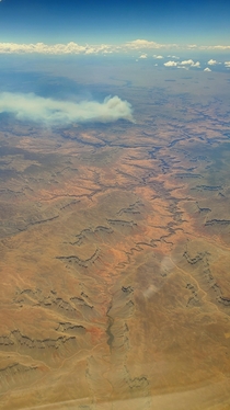 Ariel view of grand canyon with fire in the background  x