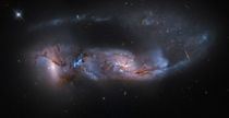 Arp  a strongly distorted pair of galaxies is seen about  million years after their close encounter The havoc wreaked by their collision is detailed in their twisted streams of gas and dust a chaos of massive star formation and a tidal tail stretching for