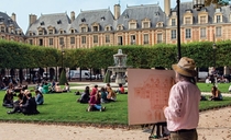 Artist at work in the Place des Vosges Paris