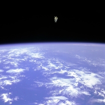 Astronaut Bruce McCandless floating away from the safety of the space shuttle with nothing but his Manned Maneuvering Unit keeping him from drifting into the unknown First person in history to do something like this