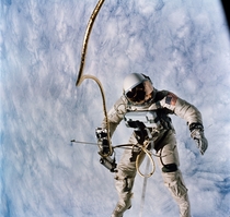 Astronaut Edward H White pilot for the Gemini IV spaceflight floats in space during the first spacewalk by an American 