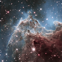 At the edge of NGC  Captured in infrared light by Hubble it lies  light-years away in the constellation Orion and is associated with the open star cluster NGC 
