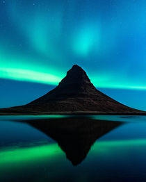 Aurora dancing over Kirkjufell Iceland 
