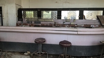 Bar from a ghost town in NM with empty bottles on the counter