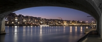 Basel under the Bridge - the view of Basel Switzerland from along the Rhine  by Frederic Huber