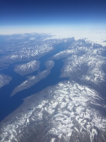 Beautiful Greenland archipelago taken from the window seat of a plane 