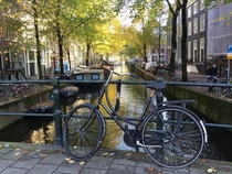 Bicycle tied up on a bridge in Amsterdam Netherlands 
