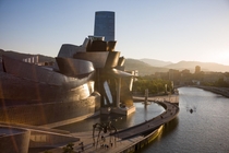 Bilbao Spain Where giant spiders walk the banks of the Nervin river catching boats next to the Guggenheim Museum 
