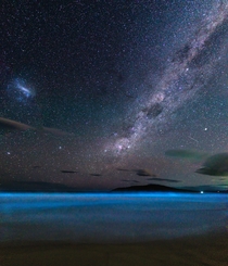 Bioluminescent algae and the milky way rising over South Arm TasmaniaI believe the ISS is also present just to the right above the clouds 