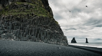Black sand and basalt columns at Reynisfjara South Iceland 