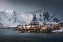 Black storm clouds wind and snow enshrouded the islands around the little village of Sakrisy Norway by photographer Jennifer Frickell 