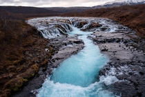 Brarfoss in Iceland - Waterfall with bright blue water color 