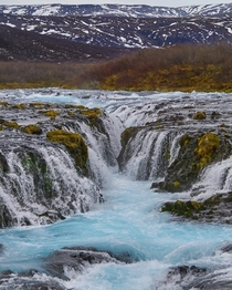 Bruarfoss Waterfall Iceland - Glacier water flowing through lava rock 