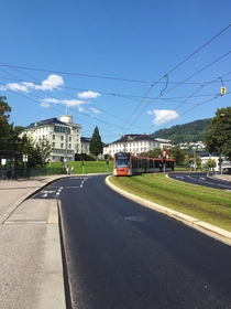 Bybanen light rail alongside a bus stop and a bike path in Bergen Norway 