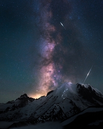 Casually night climbing to the peak of the tallest volcano in the Pacific Northwest under the Milky Way and falling space particles Mt Rainier Washington 