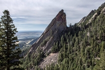 Climber reaches top of Flatiron  Boulder CO 