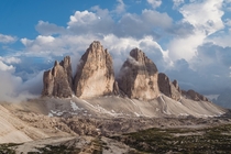 Clouds floss between the three peaks of Lavaredo in the Dolomites Italy 