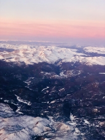 Cotton Candy Colorado Sunrise on mountains just outside Fort Collins Colorado seen on flight to Denver this morning 