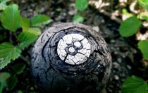 Cracked  ball on a forest Forgotten Games by Jaziel 