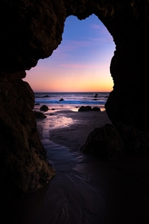 Crawled under my favorite rock formation to geta window view of a Malibu CA sunset 